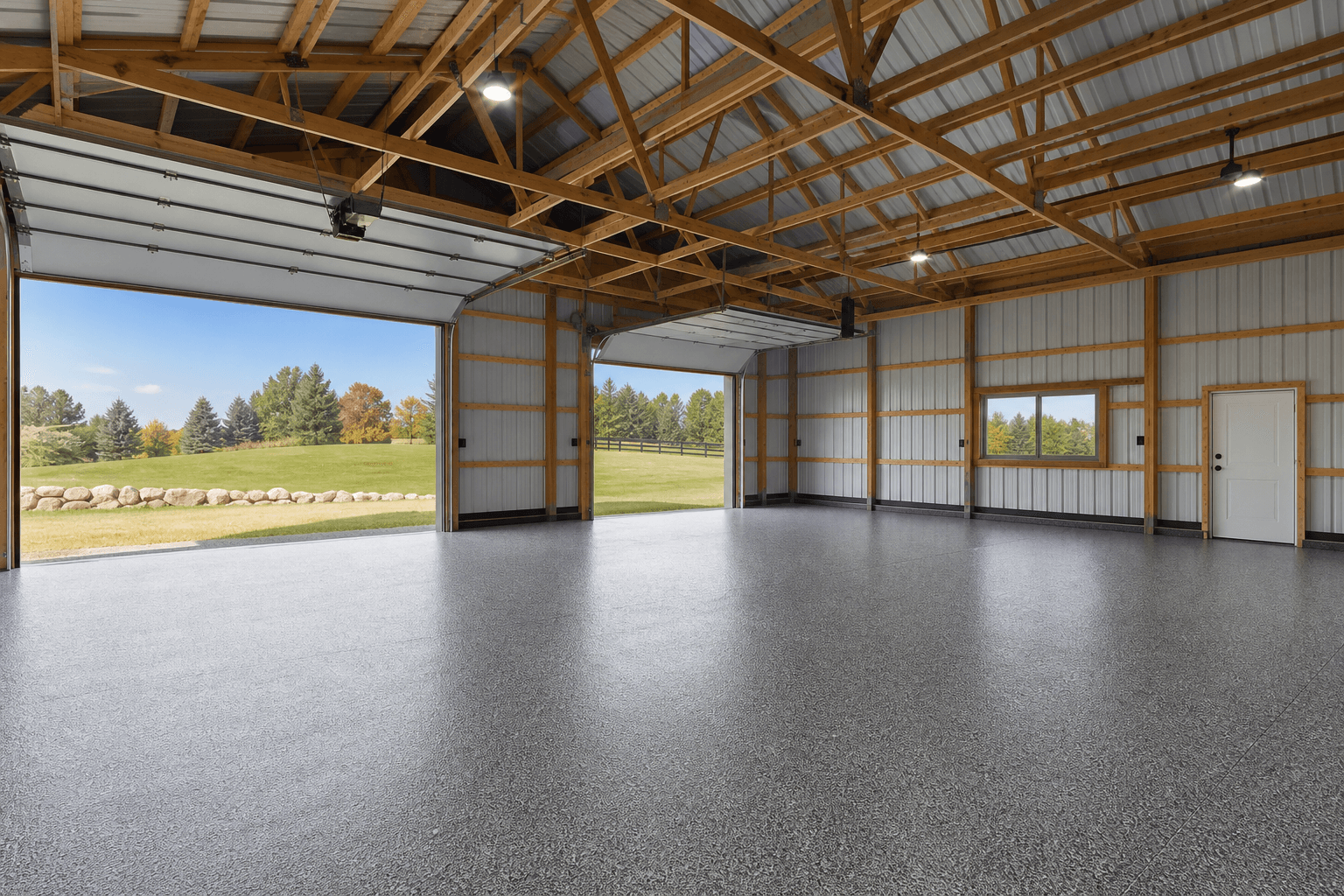 Large rural garage with grey flake epoxy near Hartland Michigan