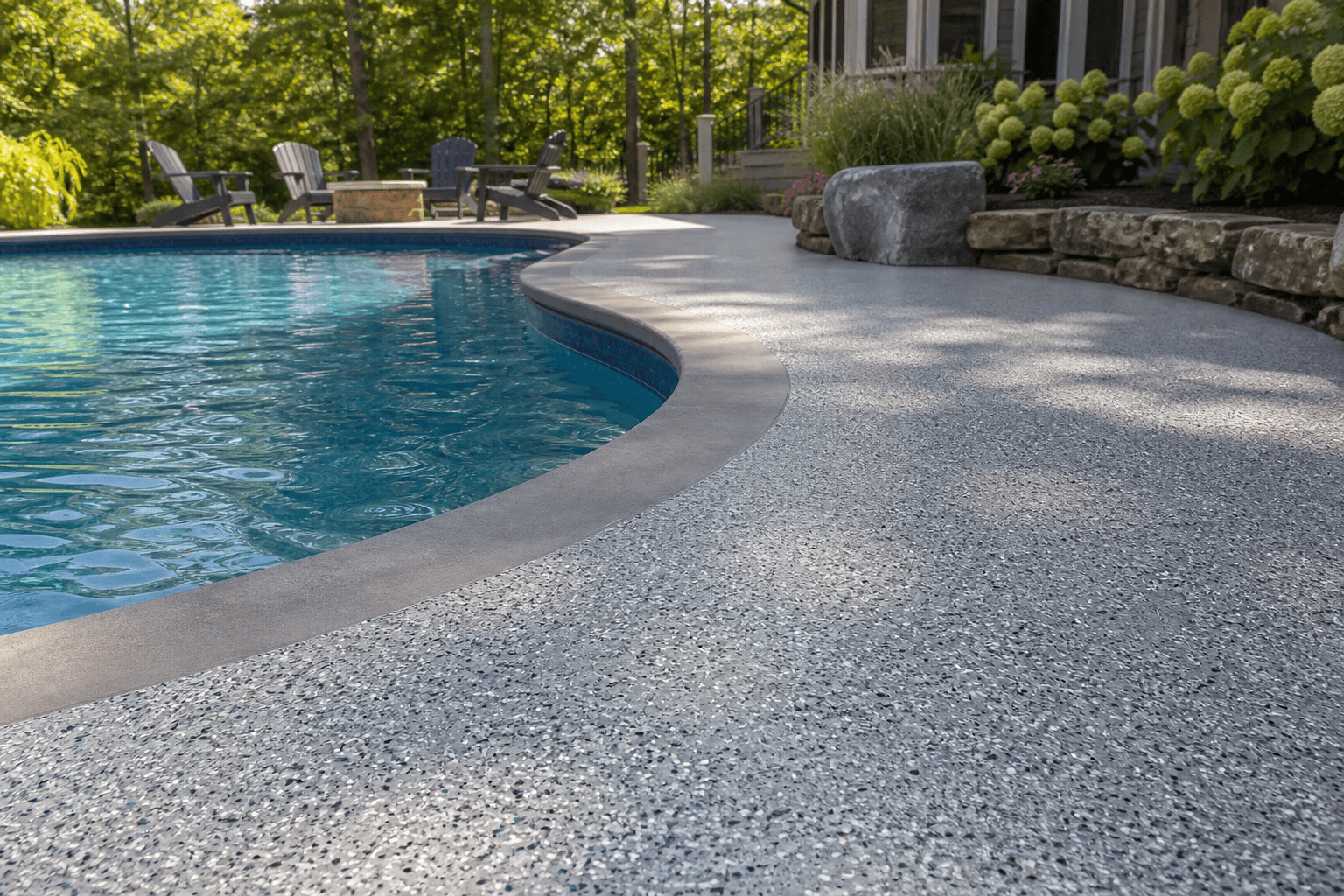 Outdoor walkway epoxy coating near a Milford backyard pool